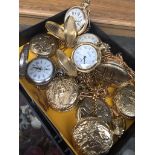 Ten reproduction pocket watches.