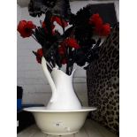 A white Jug and Bowl set with artificial poppies