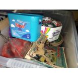 A box of collectables to include rubber dolls, Robertsons Gollies, various games and a tin of badges