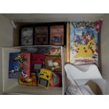 A collection of Pokemon items to include over 300 cards in binder + 2 X 3 card displays, 2 sealed