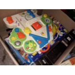 A box of childrens toys and games including activity centre, nativity set, toy gun, toy truck etc