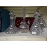A collection of crystal decanters and glasses