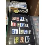 Box of FDCs and mint stamp packs, together with an album of mainly mint stamps, some high value.