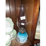 An antique pressed glass oil lamp