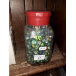 A coffee jar full of marbles