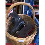 A wicker basket with vintage leather ice skating boots