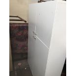 A large modern white cupboard