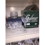 A boxed set of 6 Galway Irish Crystal glasses; 5 crystal sherry glasses; and a Stuart Crystal posy