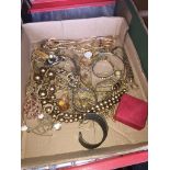 A tray of gold tone costume jewellery