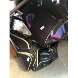 2 sports bags containing cricket equipment to include pads, a New Balance curved cricket bat, a