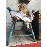 Vintage dolls chair with collectors doll.