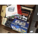 A box of cameras to include Polaroid EK100, Argus digital camera, pair of vintage binoculars,