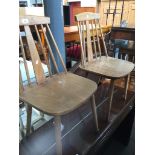 a pair of retro spindle back chairs