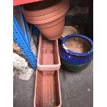 Pottery and plastic planters and plastic troughs.