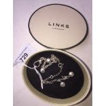 A Links of London silver charm bracelet, length 20cm, with box.