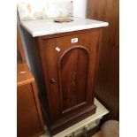 A marble top pot cupboard