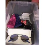 A box of sunglasses to include Police, Lacoste, Calvin Klein, Oakley, Eagle Eyes, Givenchy, etc. -