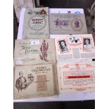 A collection of cigarette card booklets