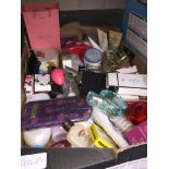 A box of cosmetics including perfumes, etc