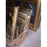 A box of gilded picture frames and three other larger gilded picture frames