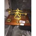 Brass and wood postal scales and weights