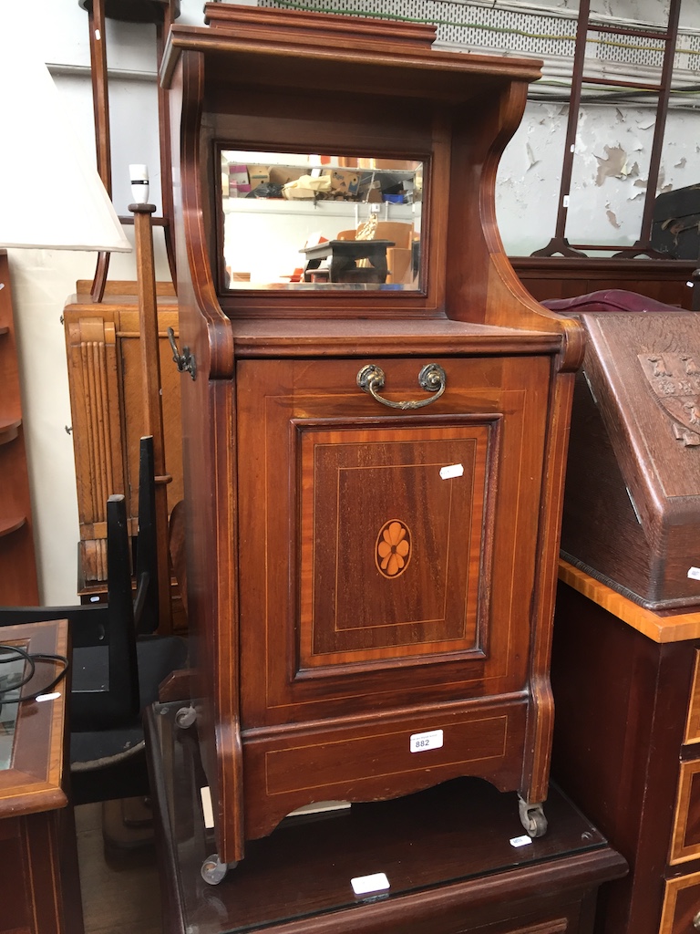 An Edwardian inlaid and lead lined coal box cabinet with mirrored back.