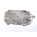 A small early 20th century white metal chain mail purse, marked '800', length 9cm.