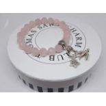 A Thomas Sabo Charm Club facetted rose quartz bracelet with two charms marked '925', diameter 6cm,