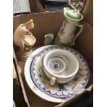 A box containing a large jug and basin set, matching chamber pot, another basin, a composite