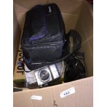 A box of mainly camera related items to include a 1960s slide projector, a cca 1960s Kodak camera, a