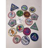 A bag containing appx 16 scouting/guiding sew on badges