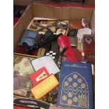 A box of collectables including vintage bank book, mini totem pole, etc.