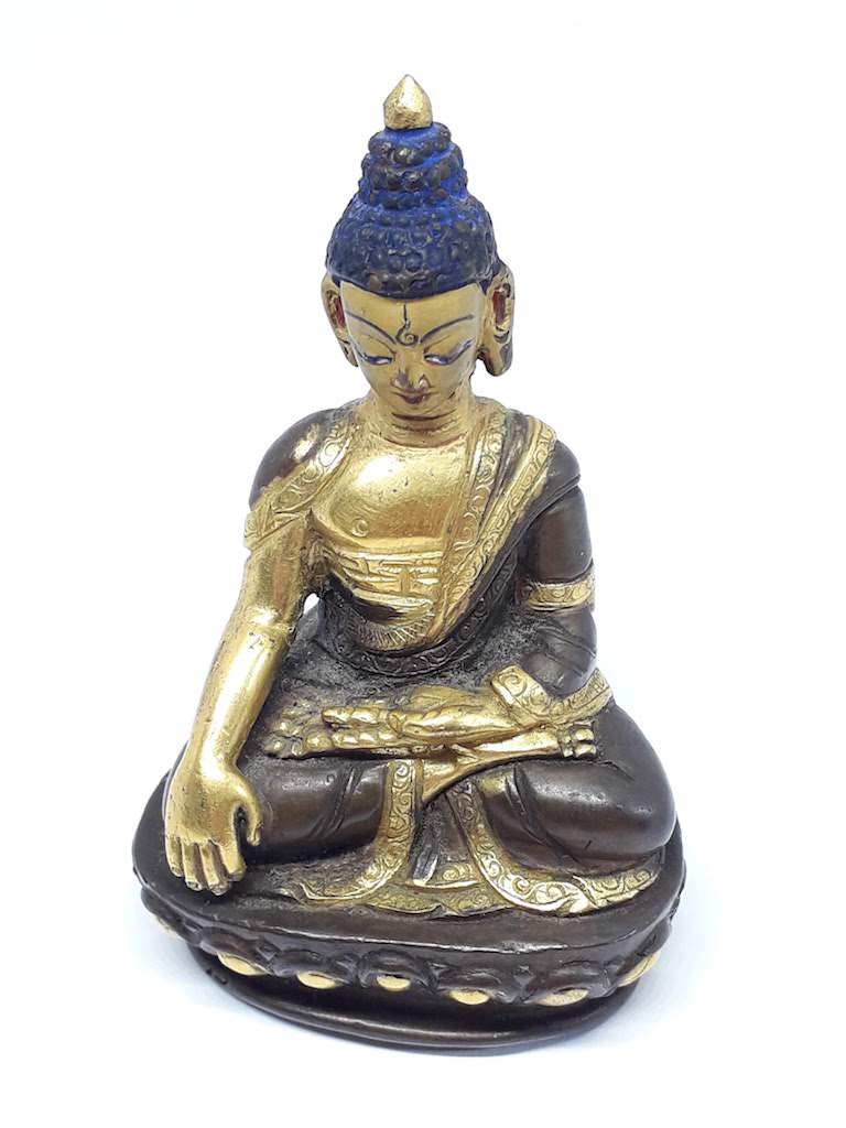 A miniature gilt bronze buddha, height 8cm.