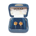 A pair of vintage rolled gold flower head earrings.