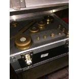 17 brass bullion weights in lockable fitted case with keys, approx. 15kg