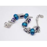 A Pandora charm bracelet, length 19cm.