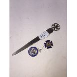 Silver letter knife and two metal badges