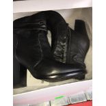 A pair of Steve Madden ladies leather boots, size 4.