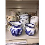 A quantity of jugs including 2 blue and white Wedgwood