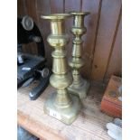 A pair of brass candlesticks