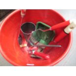 A plastic bucket containing mitchen items