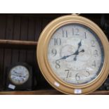 A large wall clock and a Smiths Enfield mantle clock