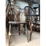 Three wheel back chairs and a spindle back chair