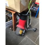 A Challenge garden shredder, a spade, and a pillar drill stand