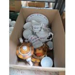 A box containing two Chinese manufactured tea sets