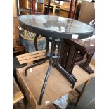 A round glass top patio table