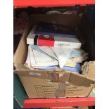 A box of misc tableware including place mats, serviettes, cutlery etc