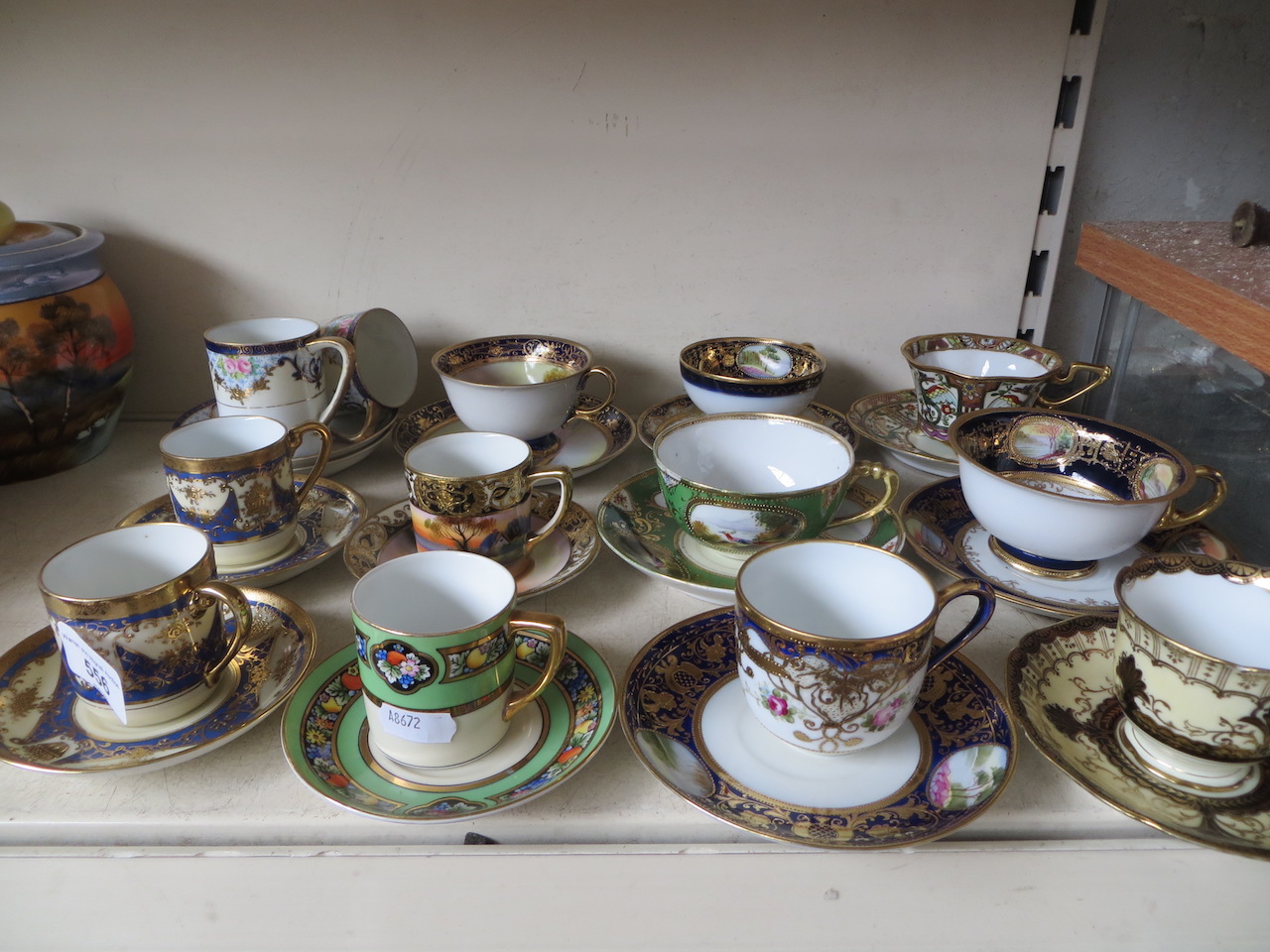 Twelve Noritake porcelain cups and saucers