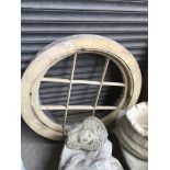 2 cartwheel style circular wooden window frames one approx 42" diameter and one approx 39" diameter