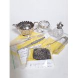 A mixed lot of hallmarked silver comprising of sugar tongs, silver handled knife andsilver pickle